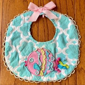 Mud pie | ornate fish fancy bib.